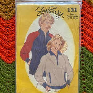 May include: Sew Easy pattern number 131 for a teen's powder jacket. The pattern includes sizes 14, 16, 18, and 20. The pattern shows two models wearing the jacket in different colors. The pattern is on a yellow background.