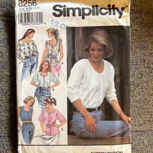 May include: Simplicity sewing pattern number 8256 for sizes 10-16. The pattern includes instructions for making five different tops, including a white long-sleeved top, a pink short-sleeved top, and a blue sleeveless top.