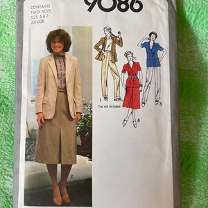 May include: Simplicity sewing pattern number 9086 for a junior size skirt and jacket. The pattern includes two sizes, 5 and 7. The image shows a woman wearing a beige skirt and jacket with a white blouse. The pattern also includes a red skirt and a blue shirt.