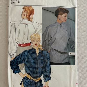 May include: A vintage sewing pattern for a women's blouse. The pattern is from Butterick and is size 8. The pattern shows three different views of the blouse, including a white blouse with a red belt, a grey blouse with a black belt, and a blue and white checked blouse with a brown belt.