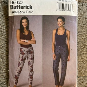 May include: A sewing pattern for pants, featuring two models wearing different styles of pants. The pattern is for sizes 16-18-20-22-24 and is from Butterick, designed by kAtheRine Tilton. The pattern number is B6327/F5.
