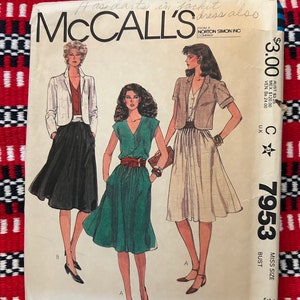 May include: A sewing pattern for a dress with a jacket. The pattern is from McCall's and is for a size 36 bust. The pattern features a green dress with a white button-up top and a white jacket. The pattern also features a white skirt with a white button-up top and a white jacket.