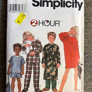 May include: Simplicity sewing pattern number 7407 for children's pajamas and a robe. The pattern includes three designs: a red nightgown, a plaid pajama set, and a robe with a dog print. The pattern is labeled "2 Hour" and includes sizes AA 3, 4, 5, and 6.