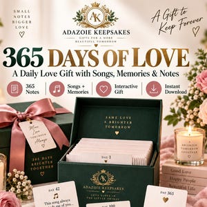 May include: A dark green gift box set titled 365 Days of Love by Adazoie Keepsakes, containing 365 notes, songs, and memories. The set includes a closed gift box with a pink ribbon, an open box with cards, candles, and printed note cards.