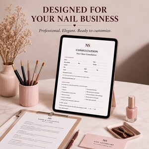 May include: A digital tablet displaying a New Client Consultation form for a nail business, accompanied by a clipboard with Terms & Conditions, a pen, a pink pen holder with brushes, a bottle of pink nail polish, and a Nail Aftercare card.