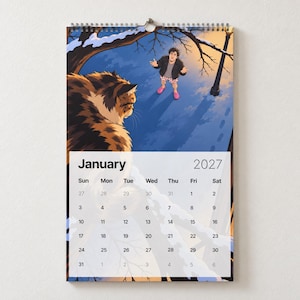 May include: A wall calendar for January 2027 featuring an illustration of a large, fluffy, brown and black cat looking down at a person standing in the snow. The person wears a black jacket, gray shirt, and patterned boxers. The calendar grid is white.