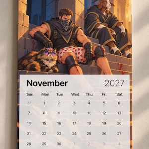 May include: A wall calendar for November 2027 featuring an illustration of a muscular person in a black bandana and heart-patterned boxers sitting on stone steps next to a fluffy cat wearing purple sunglasses and a small pink crown, with a goat-headed figure.