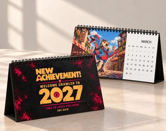 May include: A desk calendar featuring a black cover with red accents and the text NEW ACHIEVEMENT! WELCOME CRAWLER TO 2027 TIME TO LEVEL COLLAPSE: 365 DAYS. The second calendar page shows a blue dinosaur with a small creature and MARCH.