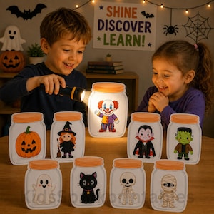 May include: A collection of ten Halloween-themed paper cutouts shaped like mason jars, each featuring a different character including a pumpkin, witch, clown, vampire, Frankenstein's monster, ghost, black cat, skeleton, and mummy.
