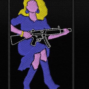 May include: A rectangular embroidered patch on a black background featuring a stylized figure with blonde hair, wearing a purple dress, holding a black submachine gun. The text "The hell" is embroidered in white above and "I wont" below the figure.