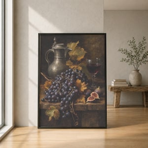 May include: A framed still life painting featuring a dark metal pitcher, a large cluster of deep purple grapes with yellowing leaves, a glass of red wine, and two halved figs arranged on a wooden surface in a moody, low-light composition.
