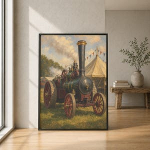 May include: A framed wall art print depicting a dark green and black steam traction engine with large red spoked wheels. The engine features a tall vertical chimney and brass detailing, set in a grassy field with a large canvas tent in the background.