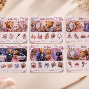 May include: Six rectangular cards featuring teddy bear illustrations categorised by theme: Make Up, Accessories, Dress, Transport, Photos, and Hair. Each card displays a central scene with a bear and smaller icons of related items, plus blank fields for tracking savings.