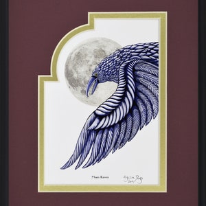 May include: Framed artwork featuring a detailed illustration of a blue raven with a full moon in the background. The raven's wing is outstretched, showcasing intricate feather details. The artwork is titled "Moon Raven" and signed by the artist.