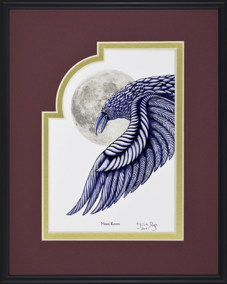May include: Framed artwork featuring a detailed illustration of a blue raven with a full moon in the background. The raven's wing is outstretched, showcasing intricate feather details. The artwork is titled "Moon Raven" and signed by the artist.