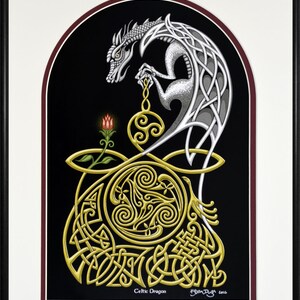 May include: A silver Celtic dragon with intricate knotwork design is holding a golden orb with a red flower below. The background is black with a maroon border.