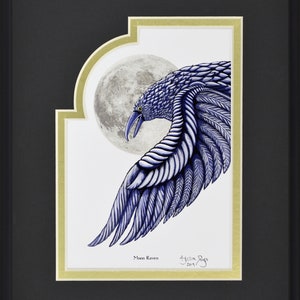 May include: Framed artwork featuring a stylized blue raven with a full moon backdrop. The raven's wing is detailed with textured feathers. The artwork is titled "Moon Raven" and signed by the artist. The frame is black with a gold inner border.