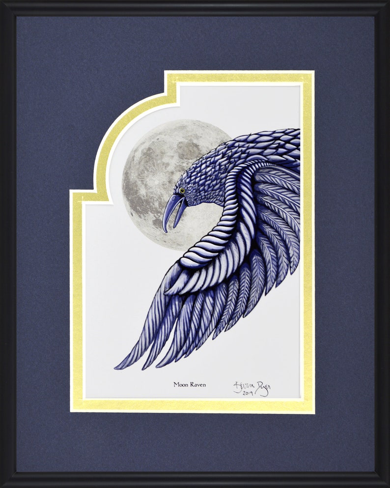 May include: Framed artwork featuring a detailed illustration of a blue raven with a full moon in the background. The raven's wing is outstretched, showcasing intricate feather details. The artwork is titled "Moon Raven" and is signed.