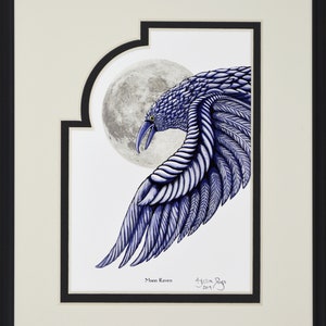 May include: Framed artwork featuring a detailed illustration of a blue raven with a full moon in the background. The raven's wing is outstretched, showcasing intricate feather details. The artwork is signed and titled "Moon Raven".