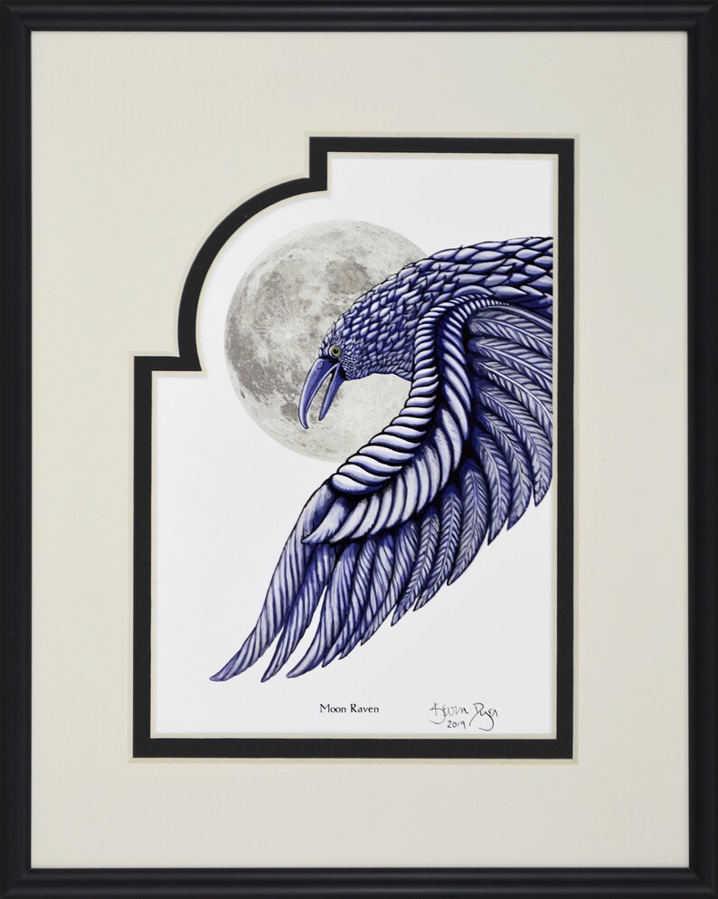 May include: Framed artwork featuring a detailed illustration of a blue raven with a full moon in the background. The raven's wing is outstretched, showcasing intricate feather details. The artwork is signed and titled "Moon Raven".