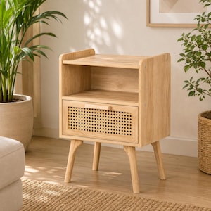 May include: A light wood nightstand featuring an open top shelf and a single drawer with a woven cane front panel. The piece is supported by four tapered legs and includes a small horizontal wooden handle centered on the drawer front.