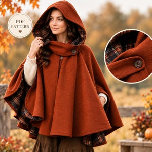 May include: A burnt orange hooded cape featuring a dark plaid lining in shades of brown, orange, and blue. The garment includes a single brown button closure at the neck and a hood. A circular badge in the corner displays the text PDF PATTERN.