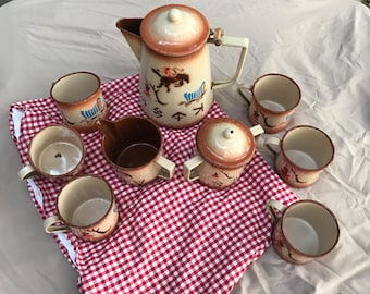 Servizio da caffè vintage Nesco in smalto, in stile western, con decorazione di un cavallo imbizzarrito.