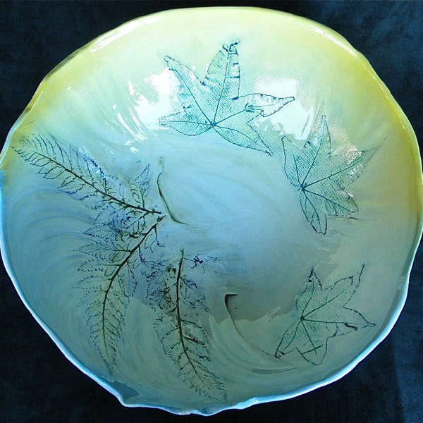 Large blue and yellow ceramic bowl with real Maple leaf and Fern impressed designs.