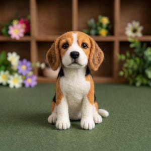 May include: A needle-felted beagle puppy figurine featuring a tri-color coat of brown, black, and white wool. The puppy is in a seated position with floppy ears, dark eyes, and a black nose, crafted with a textured, soft-looking fiber finish.