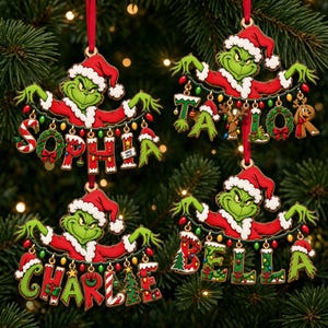 May include: Four flat Christmas ornaments featuring a green character in a red Santa suit holding a string of colourful lights. Each ornament displays a different name: Sophia, Taylor, Charlie, or Bella, with letters decorated in festive patterns.