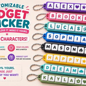 May include: A collection of eight rectangular fidget clicker keychains in various colors including purple, pink, teal, blue, black, yellow, and green. Each keychain features white square buttons with letters and icons attached to a metal ball chain.
