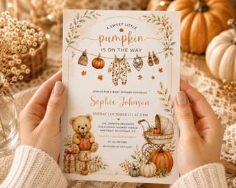 May include: A rectangular baby shower invitation card featuring watercolor illustrations of pumpkins, a teddy bear, baby clothes on a clothesline, and a vintage carriage. The text reads A SWEET LITTLE PUMPKIN IS ON THE WAY, Sophie Johnson, and event details.