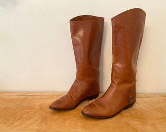 etienne aigner riding boots with stamped logo