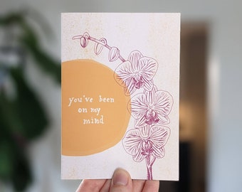 You've been on my mind gold and purple orchid greeting card