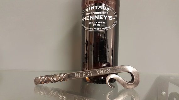 Hand-forged by a real blacksmith in Cumbria, this reverse-twist bottle opener is functional workshop craft — the kind of thing that sits on a kitchen counter and makes guests ask 'where did you get that?'