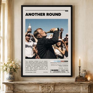 May include: A framed movie poster for Another Round, featuring a central photograph of a person in a black suit drinking from a bottle, surrounded by others. The poster includes the title, release year 2020, a plot summary, and production credits.
