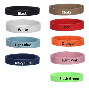May include: A collection of colorful fabric belts in various shades, including black, khaki, white, red, light blue, orange, navy blue, light pink, and flash green. Each belt is labeled with its respective color name.