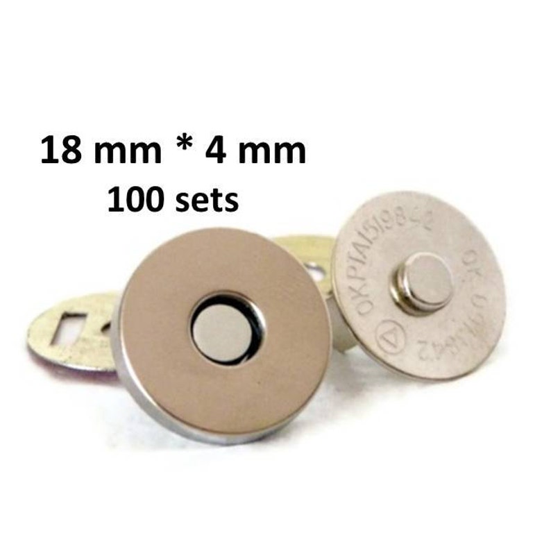 May include: A set of 100 silver magnetic snap closures, each measuring 18 mm by 4 mm. The snaps are designed for sewing onto fabric and are ideal for creating closures for bags, purses, and other projects.