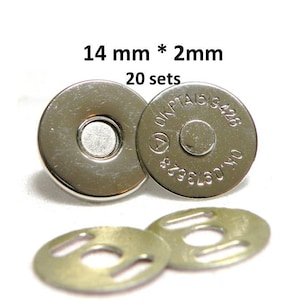May include: Twenty sets of silver magnetic snaps, each set includes two 14mm round snaps and two 14mm metal plates. The snaps have a silver finish and are marked with the text "ONPTAS 8428 8798L60 140".