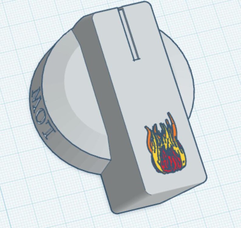 May include: A light grey circular control knob featuring a rectangular extension with a vertical groove. The word LOW is embossed on the side, and a small graphic of orange and red flames is printed on the top surface of the rectangular extension.