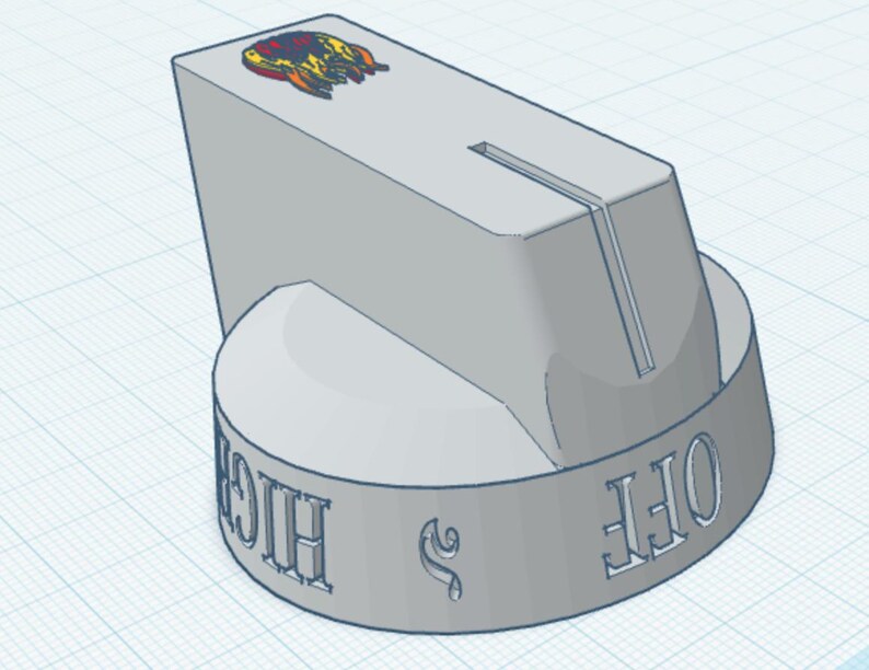 May include: A light grey control knob with a cylindrical base and a tapered top section featuring a vertical groove. The side of the base displays embossed text reading OFF and HIGH, while the top surface features a small, colourful graphic icon.