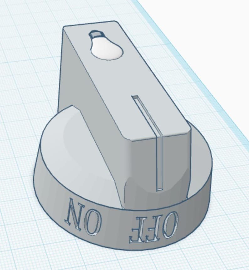 May include: A light grey cylindrical control knob featuring a vertical rectangular handle with a lightbulb icon on top. The base of the knob displays the text ON and OFF embossed in a serif font, with a thin vertical groove running down the handle.