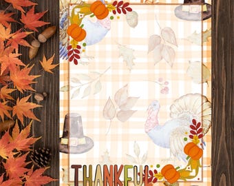 May include: A rectangular paper sheet with a light orange and white plaid background, featuring watercolour illustrations of turkeys, pumpkins, acorns, and pilgrim hats. The word THANKFUL is printed in large, colourful letters at the bottom.