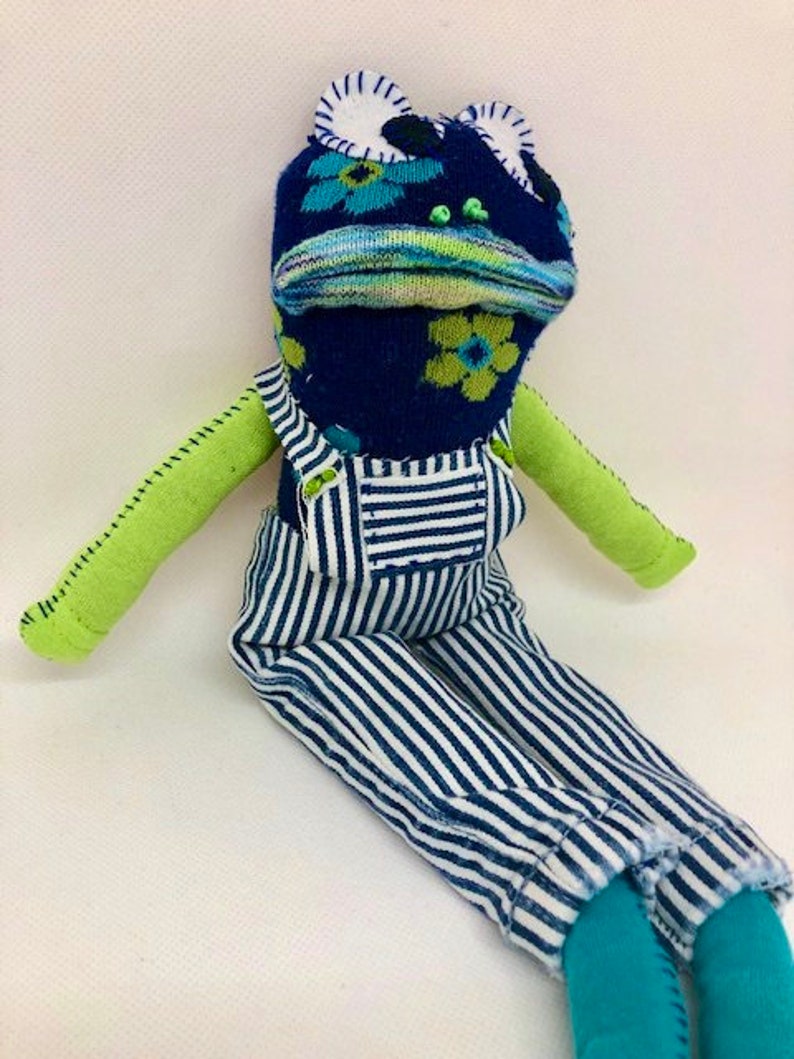 stuffed frog with overalls