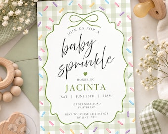 May include: A rectangular baby sprinkle invitation card featuring a light green gingham pattern with colorful sprinkles. The text reads: JOIN US FOR A baby sprinkle HONORING JACINTA SAT | JUNE 25TH | 11AM 123 SPRINKLE ROAD FAIRYBREAD RSVP TO LOUISE 0412 345 678 BY JUNE 10TH.