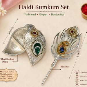 May include: A silver-toned Haldi Kumkum set featuring a 3.5-inch shell-shaped platter with green and red stone accents and a 5-inch peacock feather-shaped Tilak stick. The set includes small bowls of red and yellow powder for ritual use.