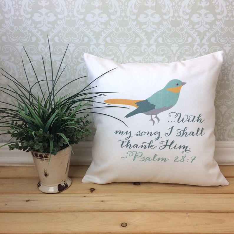 May include: White throw pillow with a blue bird and the text "...With my song I shall thank Him. ~Psalm 28:7"