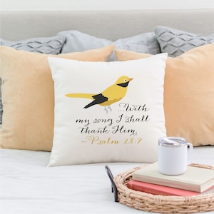 May include: White throw pillow with a yellow bird illustration and the text "...With my song I shall thank Him. Psalm 28:7"