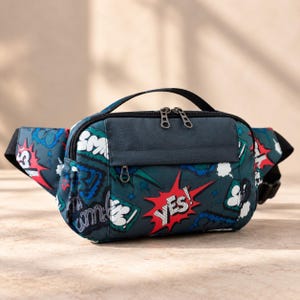 May include: A dark teal fanny pack featuring a vibrant comic book-style print with various speech bubbles and the word YES! in a red starburst. The bag includes a top handle, a front zippered pocket, and a main compartment with dual zipper pulls.