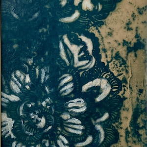 May include: A rectangular artwork featuring a dark teal and cream-colored floral pattern. The design consists of intricate, layered petal shapes with a textured, distressed appearance. The initials RER are visible in the bottom right corner.